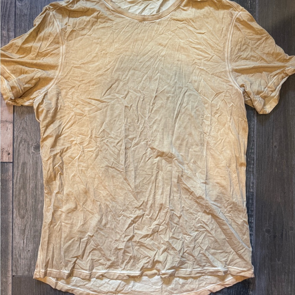 Men's Lululemon mustard colored athletic shirt